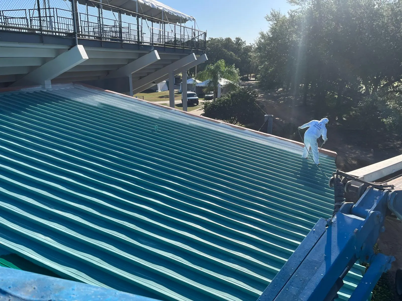 Commercial roof painting crew at work