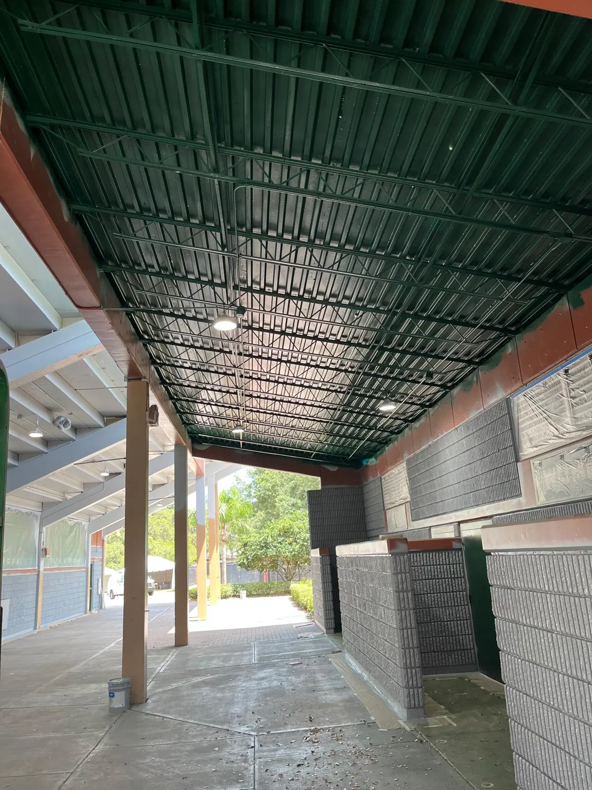 Covered walkway ceiling freshly painted dark green