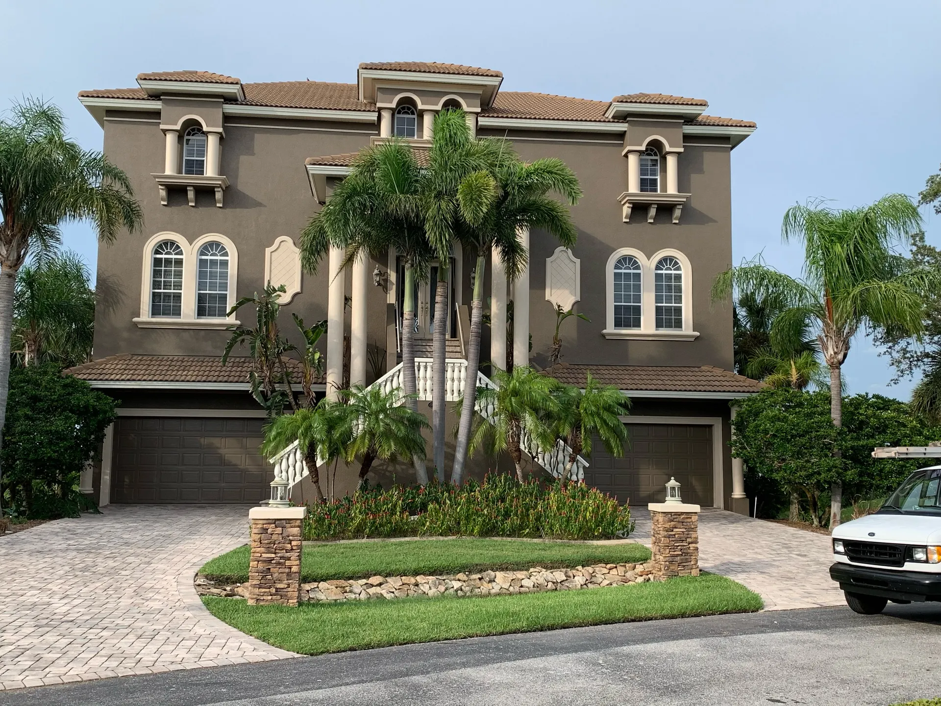Freshly painted two-story home exterior in the Tampa Bay area by Jr Pro Painting